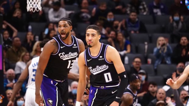 Dec 8, 2021; Sacramento, California, USA; Sacramento Kings guard Tyrese Haliburton (0) and forward Tristan Thompson (13) celebrate after a basket by Haliburton during the fourth quarter at Golden 1 Center. Mandatory Credit: Kelley L Cox-USA TODAY Sports